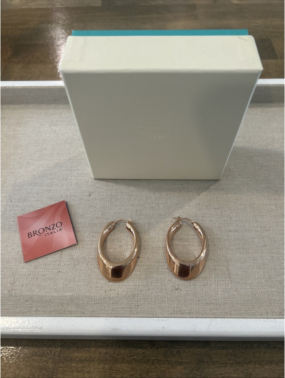 Bronze Italia 1 3/4ā Polished Graduated Oval Hoop Earrings